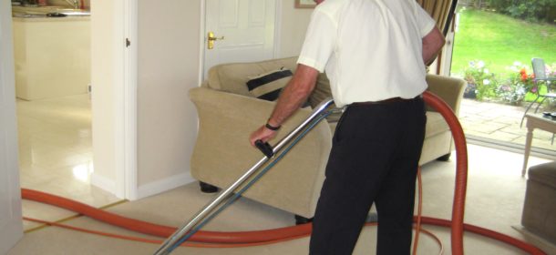 A.T. Brown & Son cleaning carpet in the living room